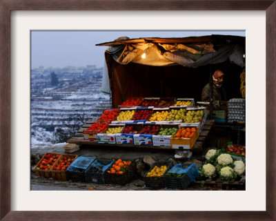 A Palestinian Fruit And Vegetable Vendor Waits For Customers by Kevin Frayer Pricing Limited Edition Print image
