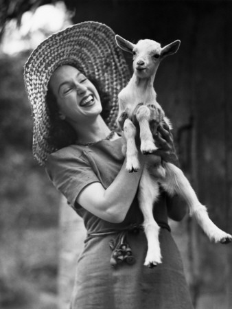 Woman Laughing And Holding A Goat by George Marks Pricing Limited Edition Print image