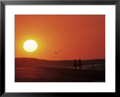 Couple Horseback Riding Into Sunset by Doug Page Pricing Limited Edition Print image