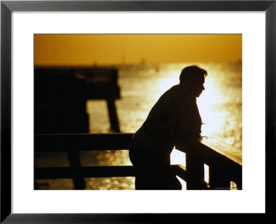 Silhouette Of Man On Pier, Fl by Jeff Greenberg Pricing Limited Edition Print image