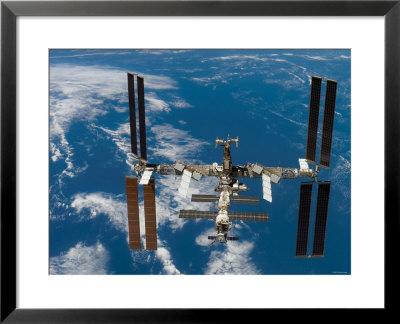The International Space Station Moves Away From The Space Shuttle Atlantis, June 19, 2007 by Stocktrek Images Pricing Limited Edition Print image