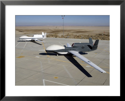 Two Global Hawks Parked On A Ramp by Stocktrek Images Pricing Limited Edition Print image