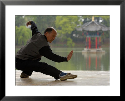 Man Doing Tai Chi Exercises At Black Dragon Pool With One-Cent Pavilion, Lijiang, China by Pete Oxford Pricing Limited Edition Print image