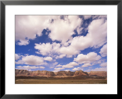 Cumulous Clouds Over The Vermillion Cliffs by John Eastcott & Yva Momatiuk Pricing Limited Edition Print image