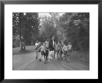 Former First Lady Eleanor Roosevelt Walking On Rustic Road With Children, En Route To Picnic by Martha Holmes Pricing Limited Edition Print image