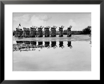 French Troops, Evacuating Hanoi, Mirrored In A Puddle As They Pass In Final Dress Review by Howard Sochurek Pricing Limited Edition Print image