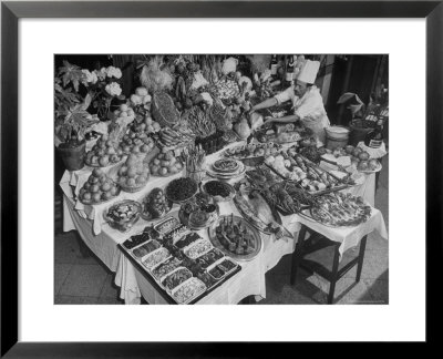Chef Domenico Giving Final Touch To Magnificent Display Of Food On Table At Passeto Restaurant by Alfred Eisenstaedt Pricing Limited Edition Print image