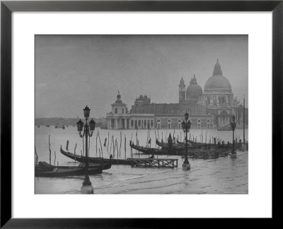 Moored Gondolas In Grand Canal By Flooded Piazza San Marco With Santa Maria Della Salute Church by Dmitri Kessel Pricing Limited Edition Print image