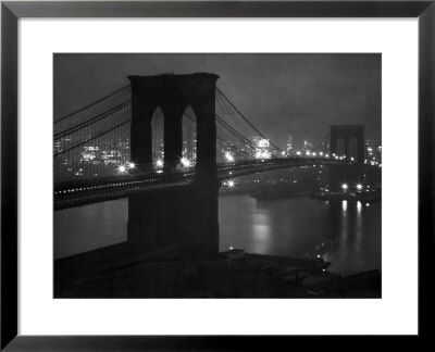 Glittering Night View Of The Brooklyn Bridge Spanning The Glassy Waters Of The East River by Andreas Feininger Pricing Limited Edition Print image
