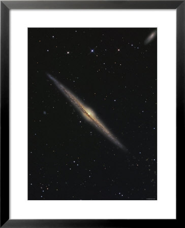Ngc 4565 Is An Edge-On Barred Spiral Galaxy In The Constellation Coma Berenices by Stocktrek Images Pricing Limited Edition Print image
