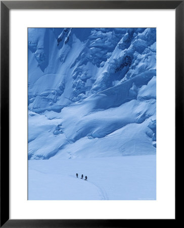 Three People Skiing Up The Kahiltna Glacier On Denali, Alaska by Bill Hatcher Pricing Limited Edition Print image