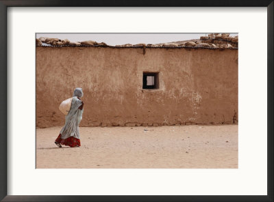 A Refugee From Western Sahara Leaves A Red Cross Food Distribution Center by Steve Raymer Pricing Limited Edition Print image
