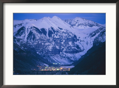 The Cozy Village Of Telluride Nestles In A Valley Between High Peaks by Paul Chesley Pricing Limited Edition Print image