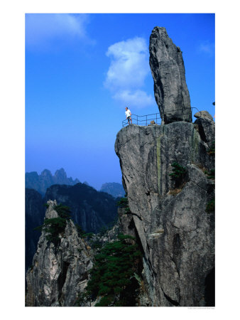 Man At Lookout On Mt. Huangshan, China by Juliet Coombe Pricing Limited Edition Print image