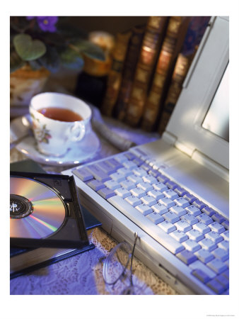 Laptop Computer, Cd-Rom, Cup Of Tea, And Books by Eric Kamp Pricing Limited Edition Print image