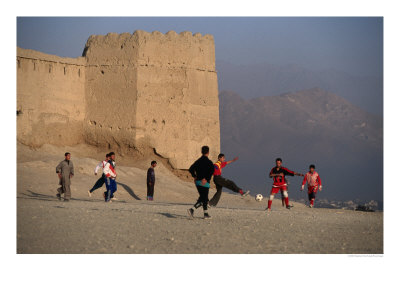 Children Playing Soccer Near Disused Fort, Kabul, Afghanistan by Stephane Victor Pricing Limited Edition Print image