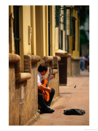 Guitarist Along Callejon Del Agua, Seville, Spain by Kindra Clineff Pricing Limited Edition Print image