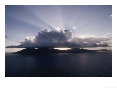 A Large Cloud Hovers Over Dominica Island by Jodi Cobb Pricing Limited Edition Print image