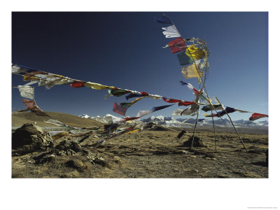 Prayer Flags Blow In The Wind Atop A High Pass On A Tibetan Plateau by Gordon Wiltsie Pricing Limited Edition Print image