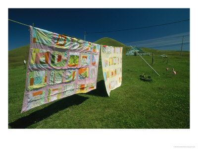 Colorful Quilts Hanging On A Clothesline by Michael Melford Pricing Limited Edition Print image