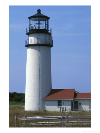 A Lighthouse Against A Blue Sky With A Wooden Fence Nearby by Darlyne A. Murawski Pricing Limited Edition Print image