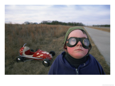 A Boy, Dressed To Travel, Stands In Front Of His Midget Racer by Joel Sartore Pricing Limited Edition Print image