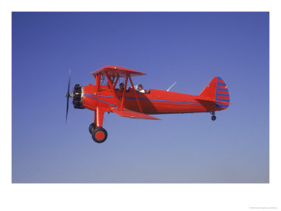 Red Bi-Plane In Flight by Larry Mcmanus Pricing Limited Edition Print image