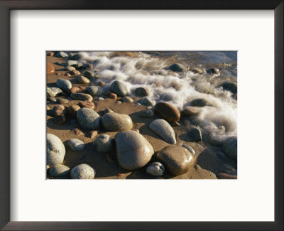 Water Washes Up On Smooth Stones Lining A Beach by Michael S. Lewis Pricing Limited Edition Print image
