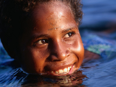 Child Playing In The Water, Manam Island, Madang, Papua New Guinea by Jerry Galea Pricing Limited Edition Print image