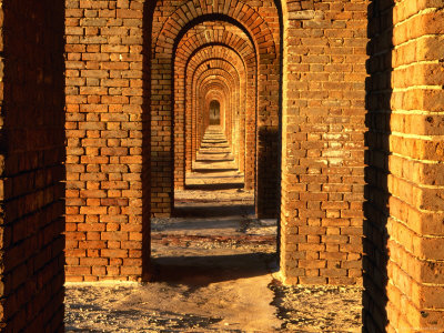 Interior Archways Of Fort Jefferson In Late Afternoon Light, Florida by Eddie Brady Pricing Limited Edition Print image