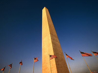 American Flags Flying At The Base Of Washington Monument, Washington D.C. by Eddie Brady Pricing Limited Edition Print image