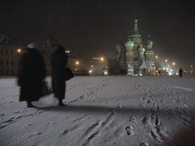 Women Walk Through The Snow To St. Basil's Cathedral In Red Square, Moscow, Russia by Sisse Brimberg Pricing Limited Edition Print image