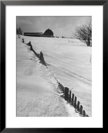 Four Ft. Of Snow Almost Covering Up Snow Fence In Front Of Barn On The Hill On Upstate Farm by Andreas Feininger Pricing Limited Edition Print image