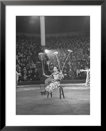 Juggler Spinning Seven Plates At Once by Thomas D. Mcavoy Pricing Limited Edition Print image