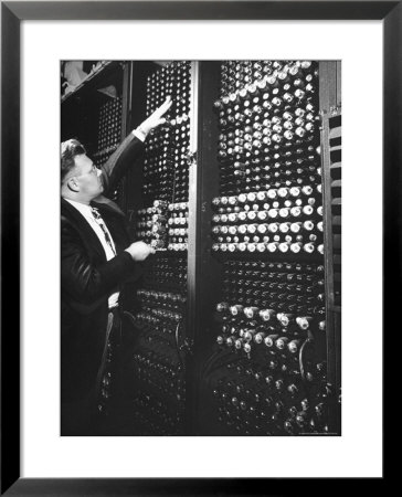 Technician Manipulating 1 Of Hundreds Of Dials On Panel Of Ibm's Room Size Eniac Computer by Francis Miller Pricing Limited Edition Print image
