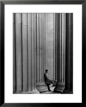 Student Leaning Against Ionic Columns At Entrance Of Main Building At Mit by Gjon Mili Pricing Limited Edition Print image