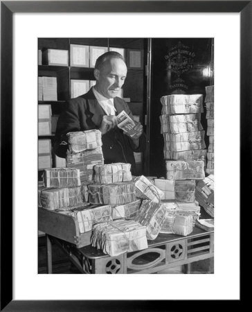 The Chief Cashier Counting Piles Of Money by Walter Sanders Pricing Limited Edition Print image