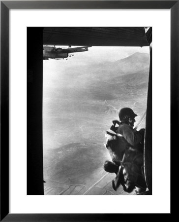 Paratrooper Making Way To Jump Off A Military Plane Into Hostile Territories by John Dominis Pricing Limited Edition Print image