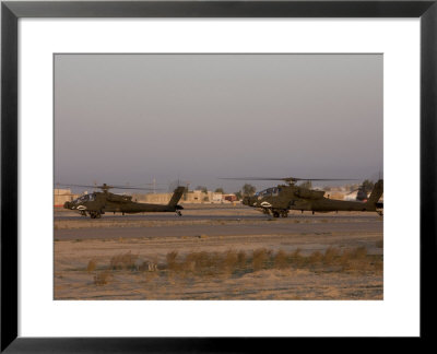 Pair Of Ah-64 Apache Helicopters Prepare For Takeoff by Stocktrek Images Pricing Limited Edition Print image