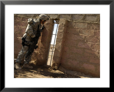 Us Army Sergeant Looks For A Sniper Who Has Fired Rounds In The Area During A Patrol by Stocktrek Images Pricing Limited Edition Print image