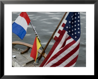 American Flag And Signal Flags Hanging From The Stern Of A Sailboat, Mystic, Connecticut by Todd Gipstein Pricing Limited Edition Print image