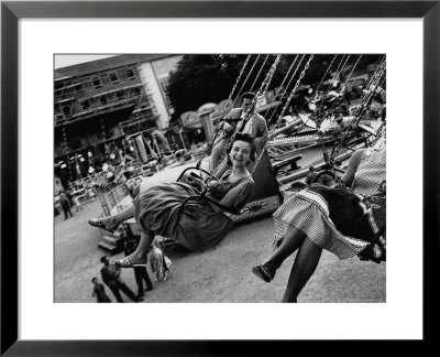 People Riding A Merry Go Round, During The Celebration Of Munich's 800Th Anniversary by Michael Rougier Pricing Limited Edition Print image