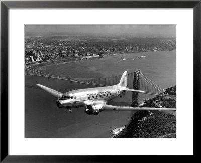 Canadian Colonial Airways Passenger Plane Flys Over George Washington Bridge In Montreal, Canada by Margaret Bourke-White Pricing Limited Edition Print image