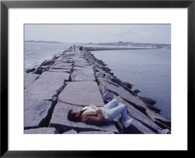 Senator Edward M. Kennedy Basking In Sun On Breakwater In Hyannis Port by John Loengard Pricing Limited Edition Print image