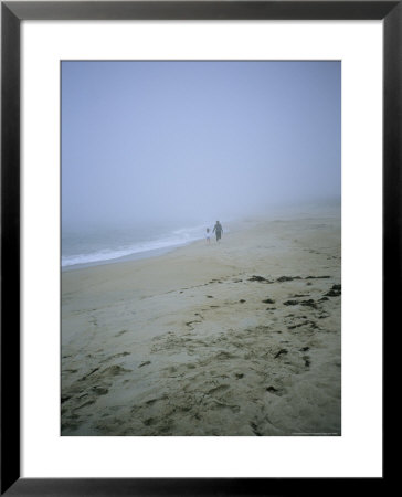 Mother And Child Walk Hand In Hand On A Misty Beach by Vlad Kharitonov Pricing Limited Edition Print image