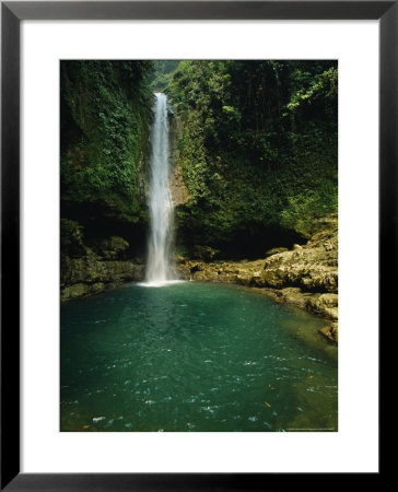 Water Runs Out Of A Cave And Forms A Waterfall by Stephen Alvarez Pricing Limited Edition Print image