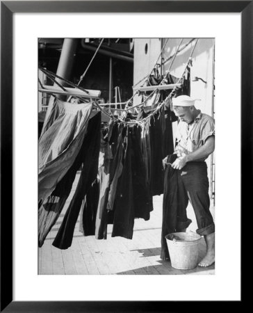 Sailor Aboard A Us Navy Cruiser At Sea Hanging Up Laundered Dungarees During Wwii by Ralph Morse Pricing Limited Edition Print image