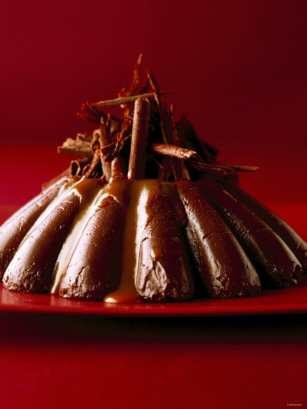 Chocolate Dessert With Grated Chocolate On Red Plate by Jörn Rynio Pricing Limited Edition Print image