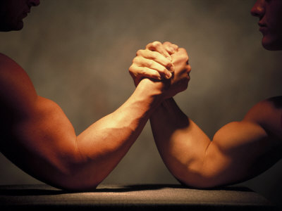 Close-Up Of Two Men Arm Wrestling by David Burch Pricing Limited Edition Print image