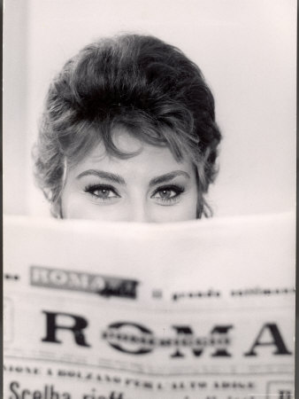 Actress Sophia Loren Impishly Peering Over The Top Of Roma Newspaper by Alfred Eisenstaedt Pricing Limited Edition Print image